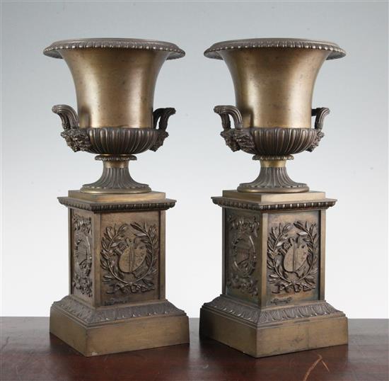 A pair of late 19th / early 20th century French campana shaped bronze urns, 13in.